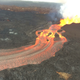 Lava streams through a channel from Fissure 8 (right) to the ocean in Kapoho bay.